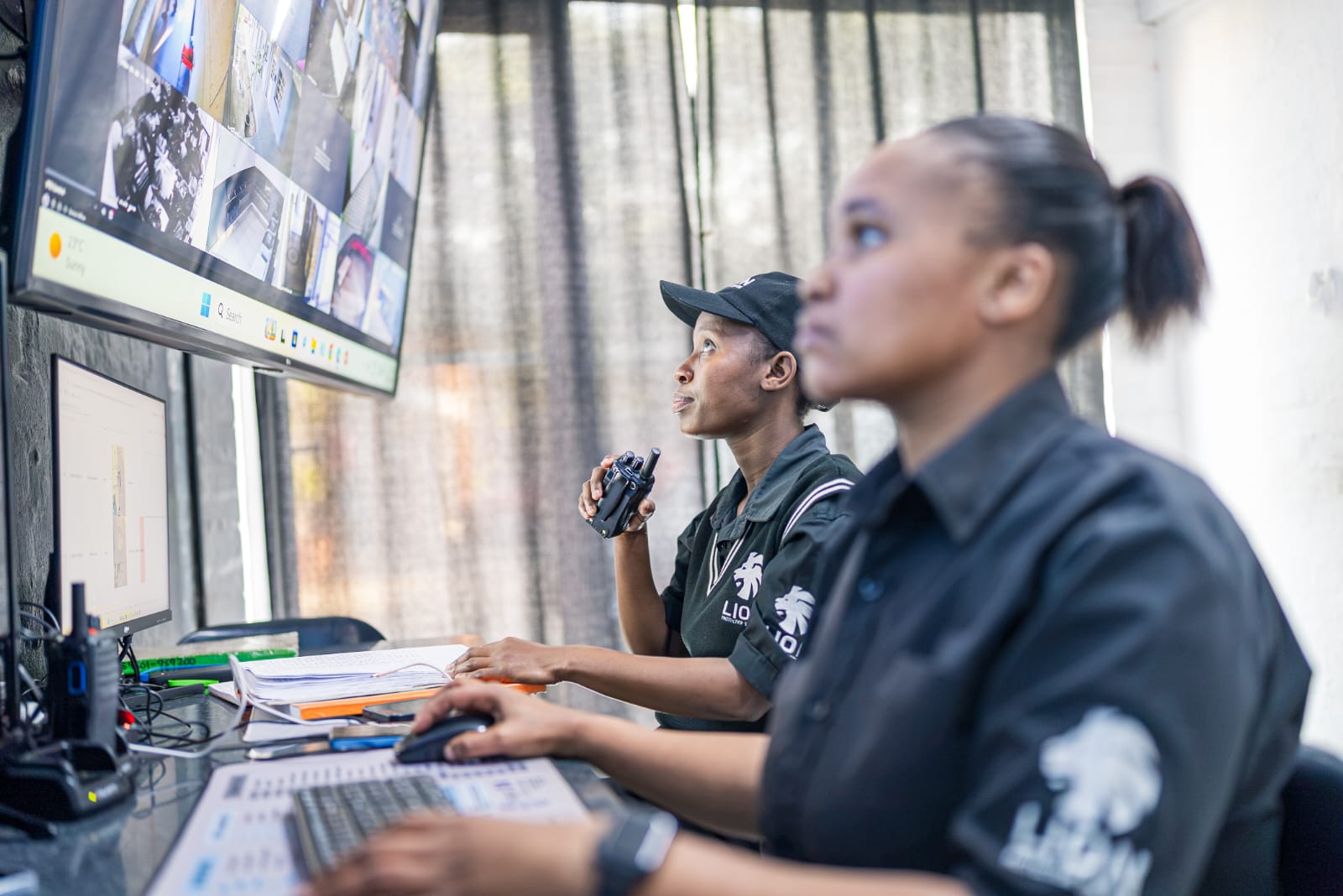 Control room operators monitoring live feeds